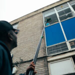 Commercial and residential windows being professionally cleaned